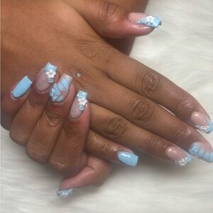 Elegant Blue and Nude Nail Art with charms